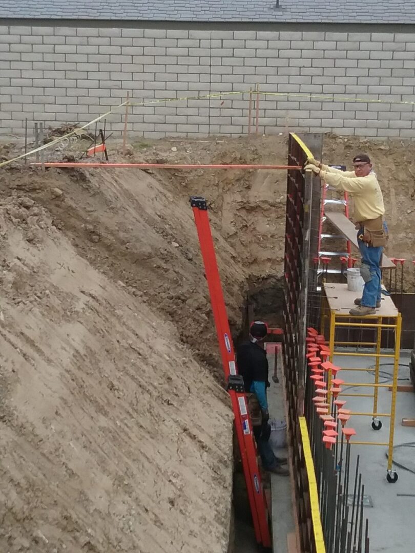 A man standing on top of a ramp next to another person.