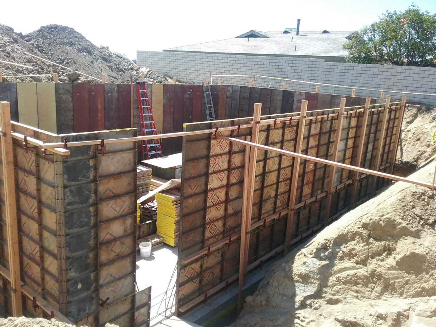 A building under construction with some type of concrete wall.