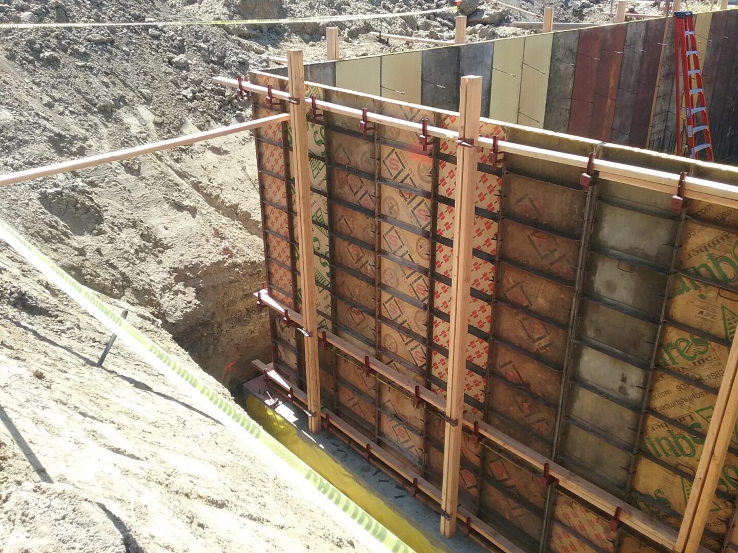 A construction site with a wall being built.