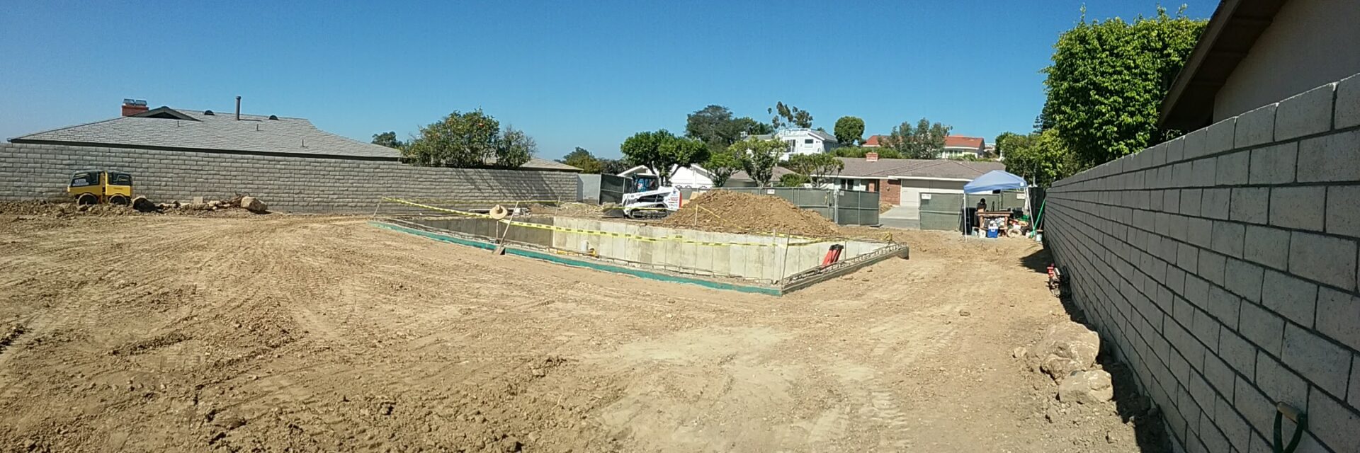 A construction site with a truck and some dirt