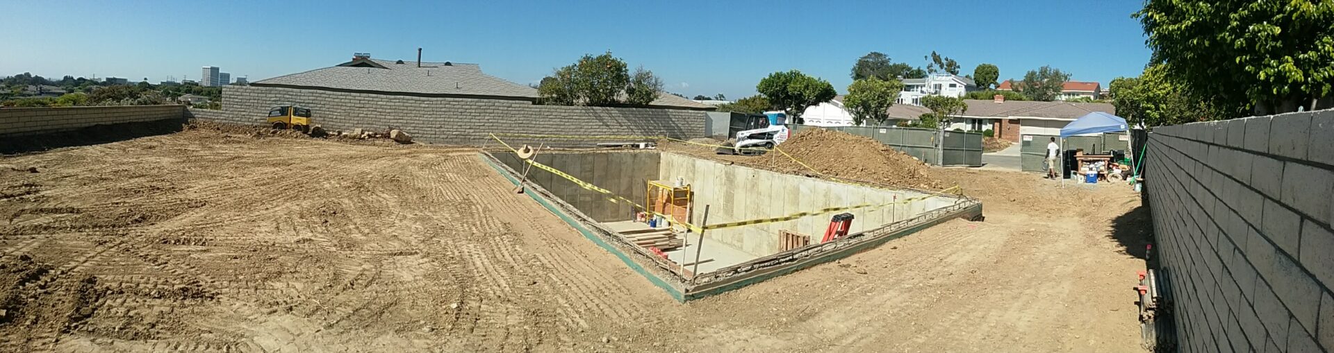 A construction site with cement walls and concrete.