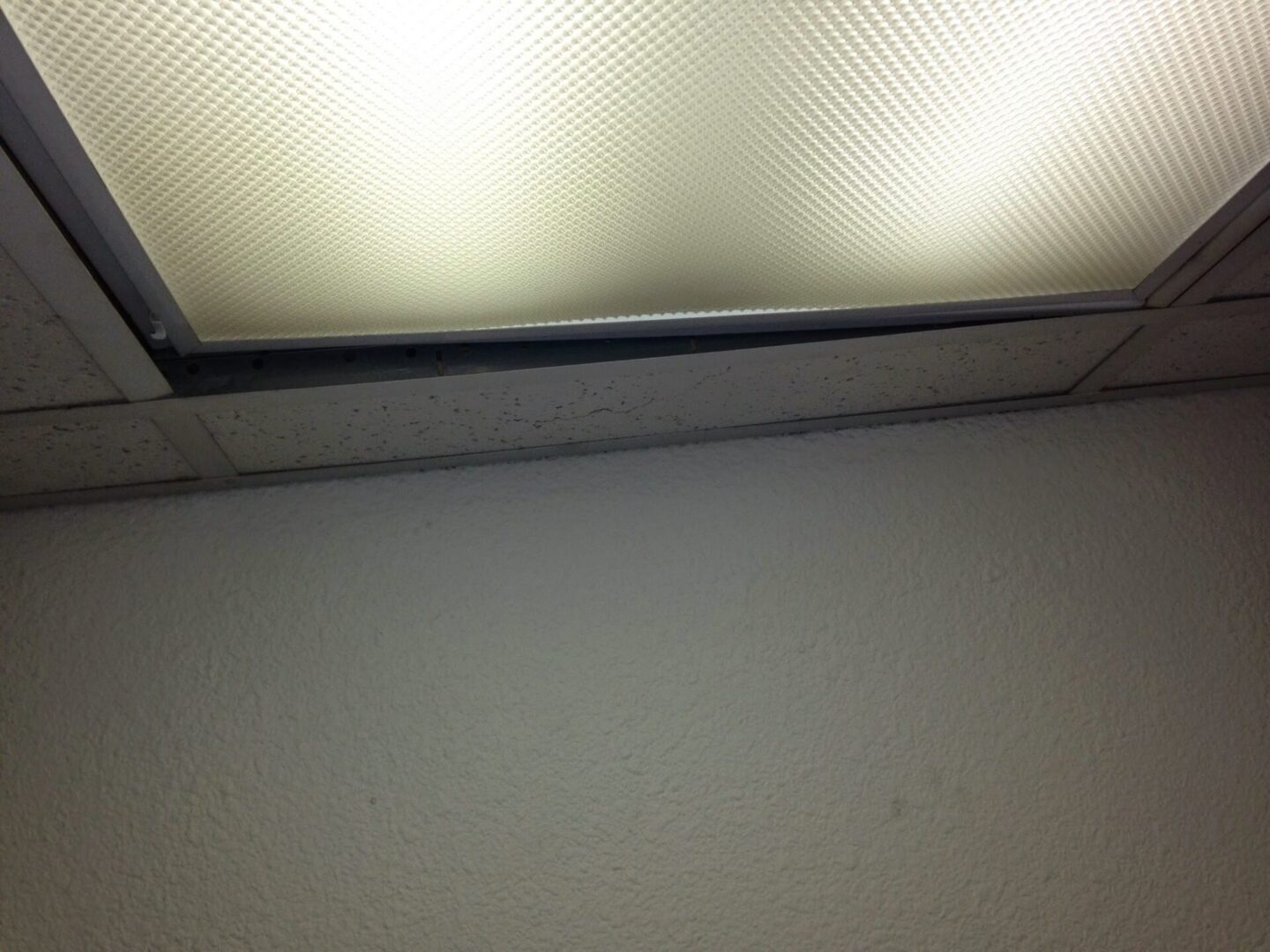 A light that is on in the ceiling.