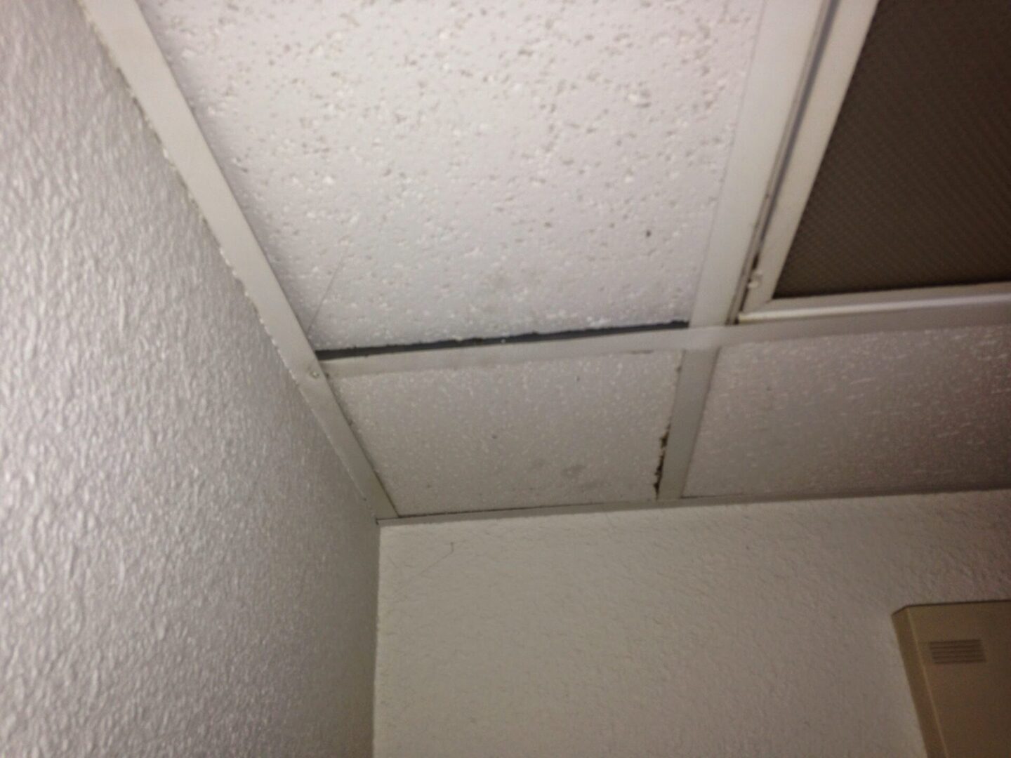 A ceiling with some holes in it