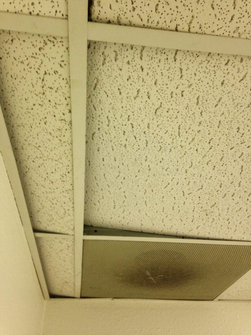 A ceiling with some holes in it