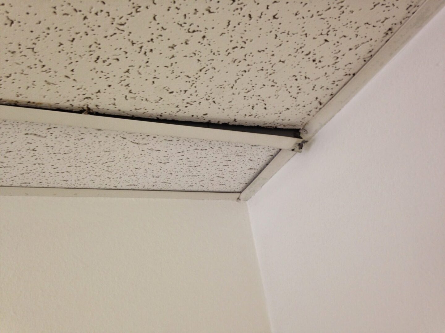 A ceiling with some holes in it