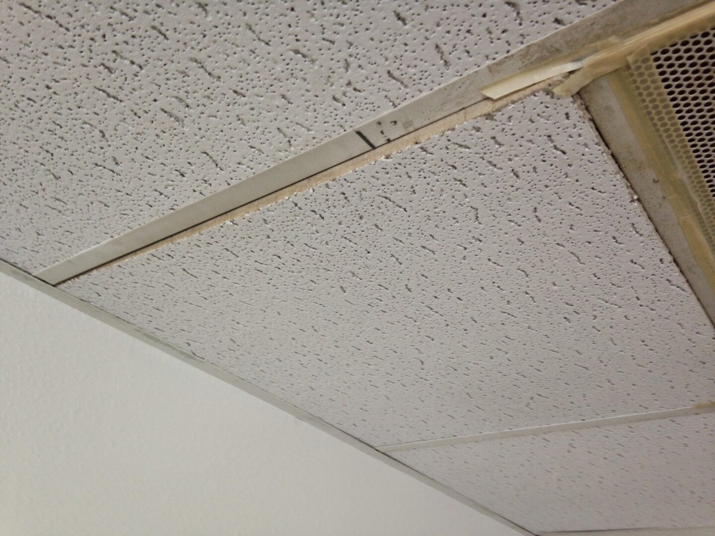 A ceiling with many holes in it