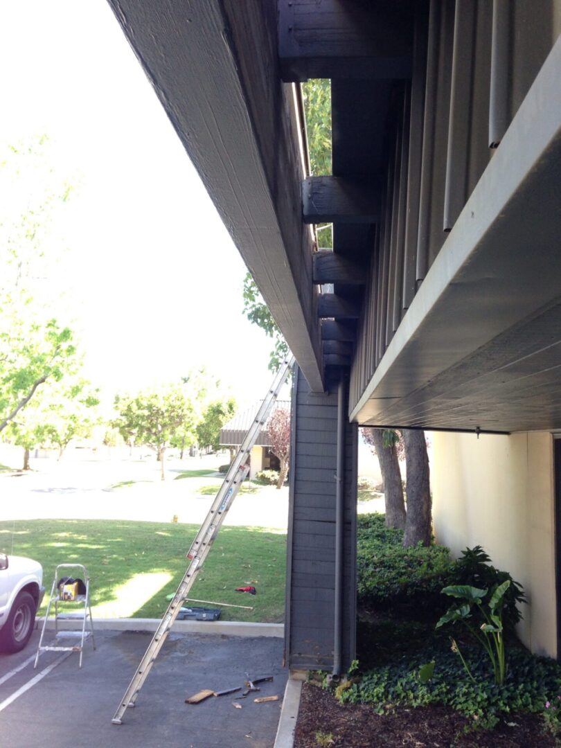 A ladder is attached to the side of a building.