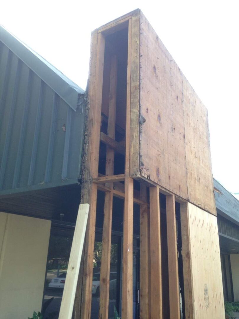 A building with some wood being installed on it