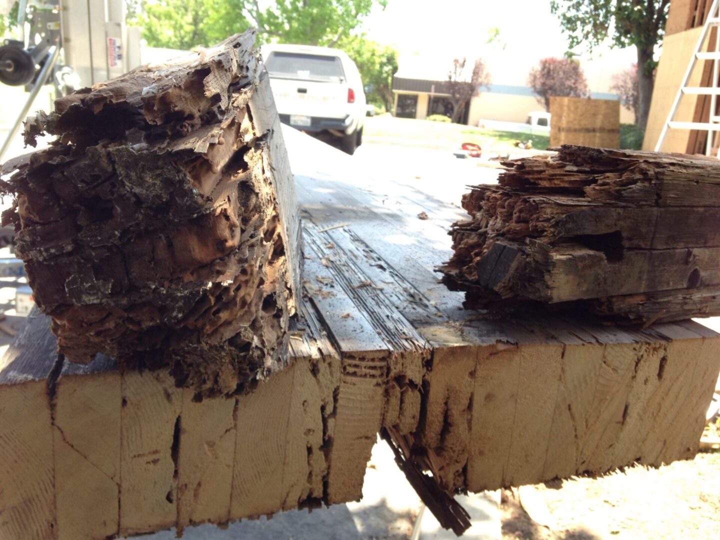 A pile of wood sitting on top of a wooden deck.