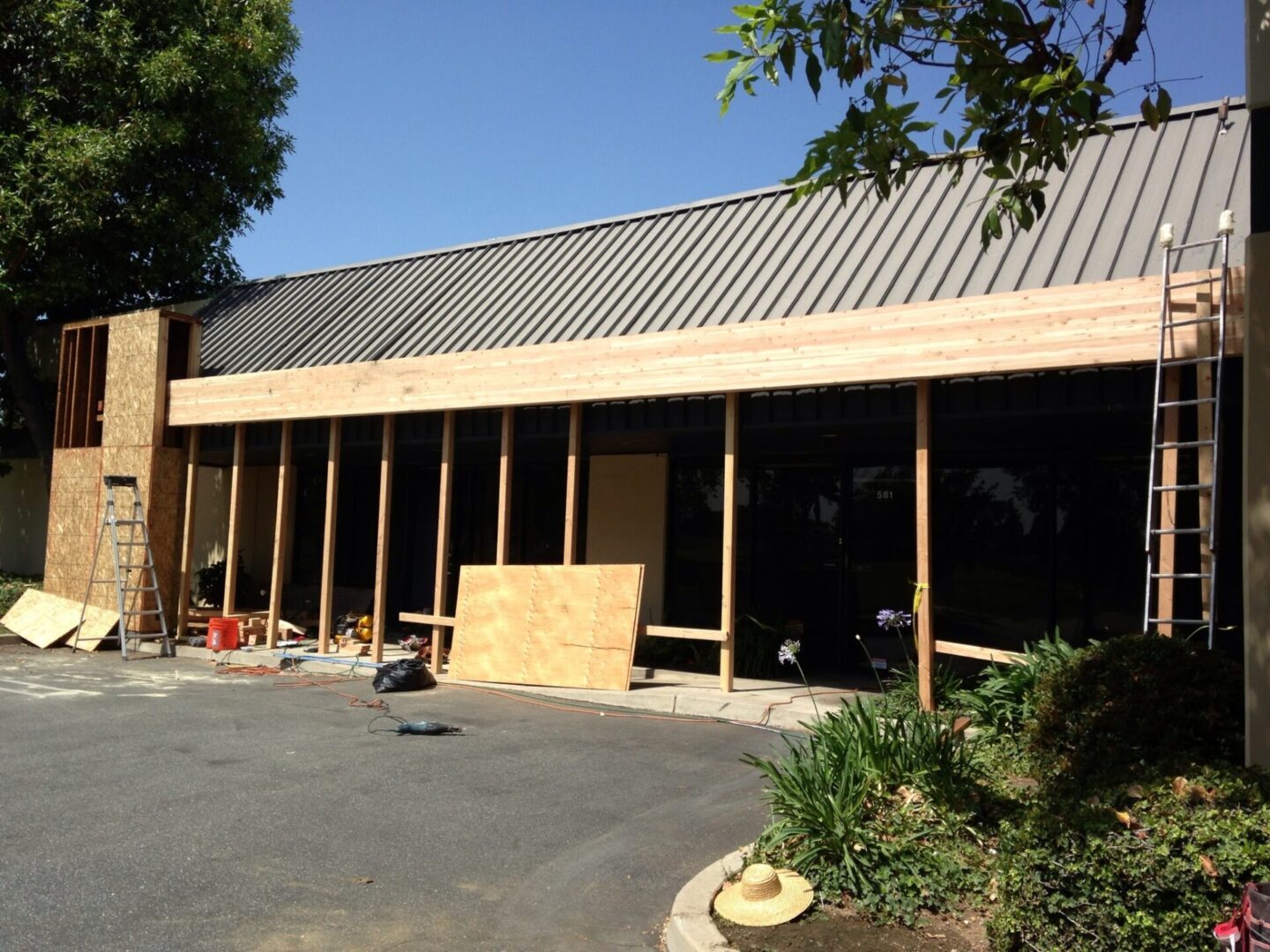 A building that is being built in the middle of a parking lot.