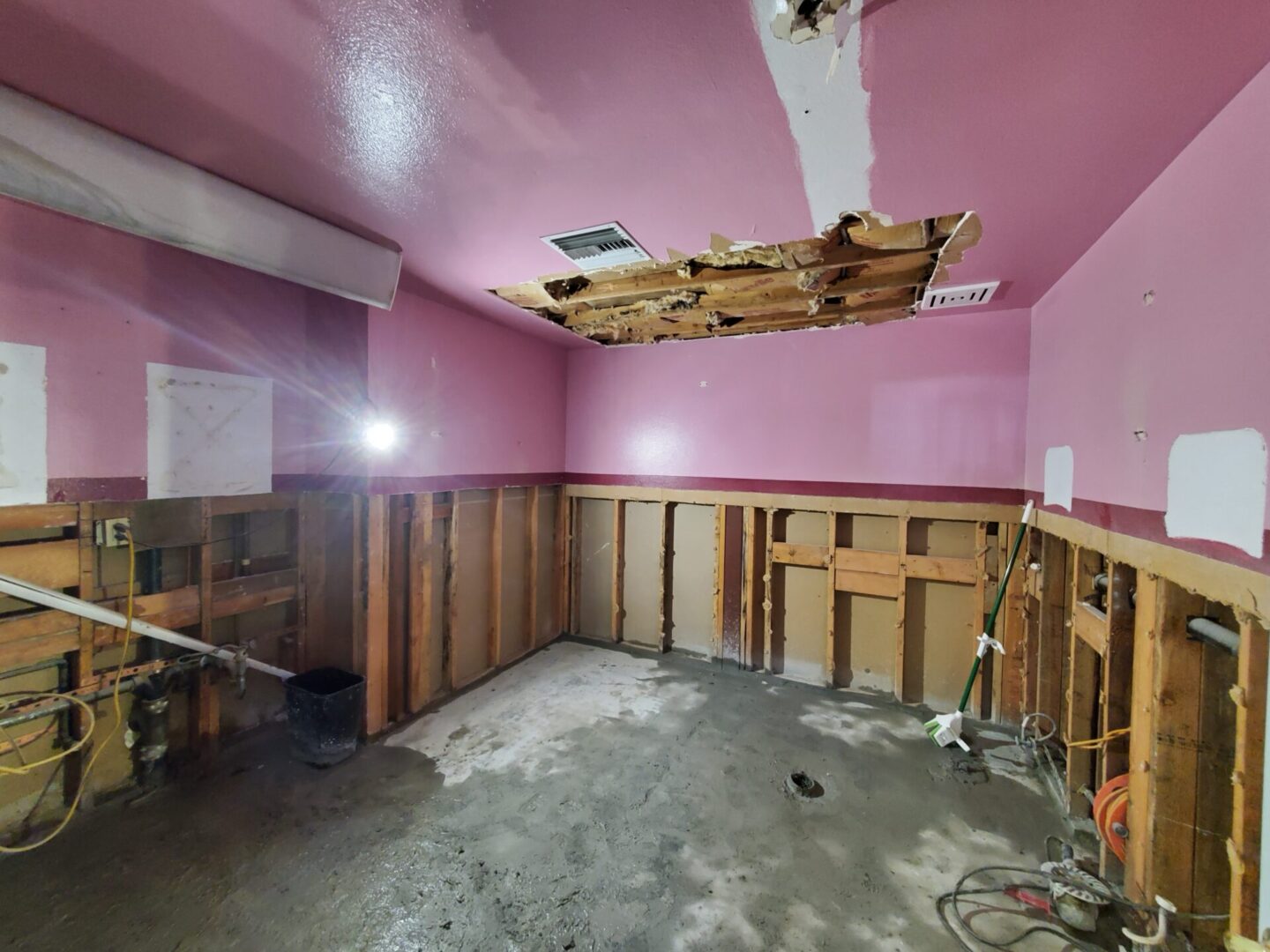 A room that has been remodeled with pink walls.