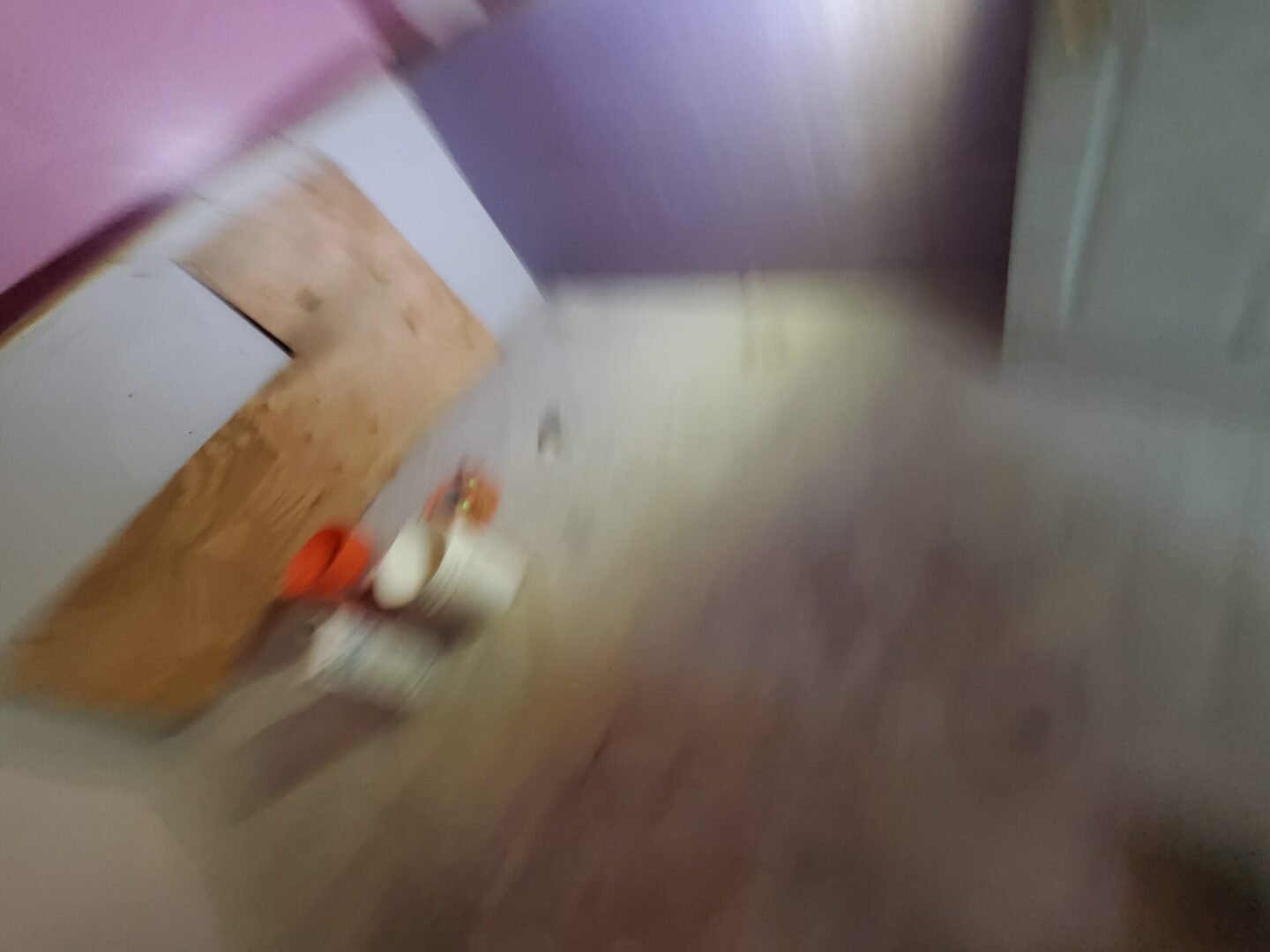 A blurry image of the floor in a room.