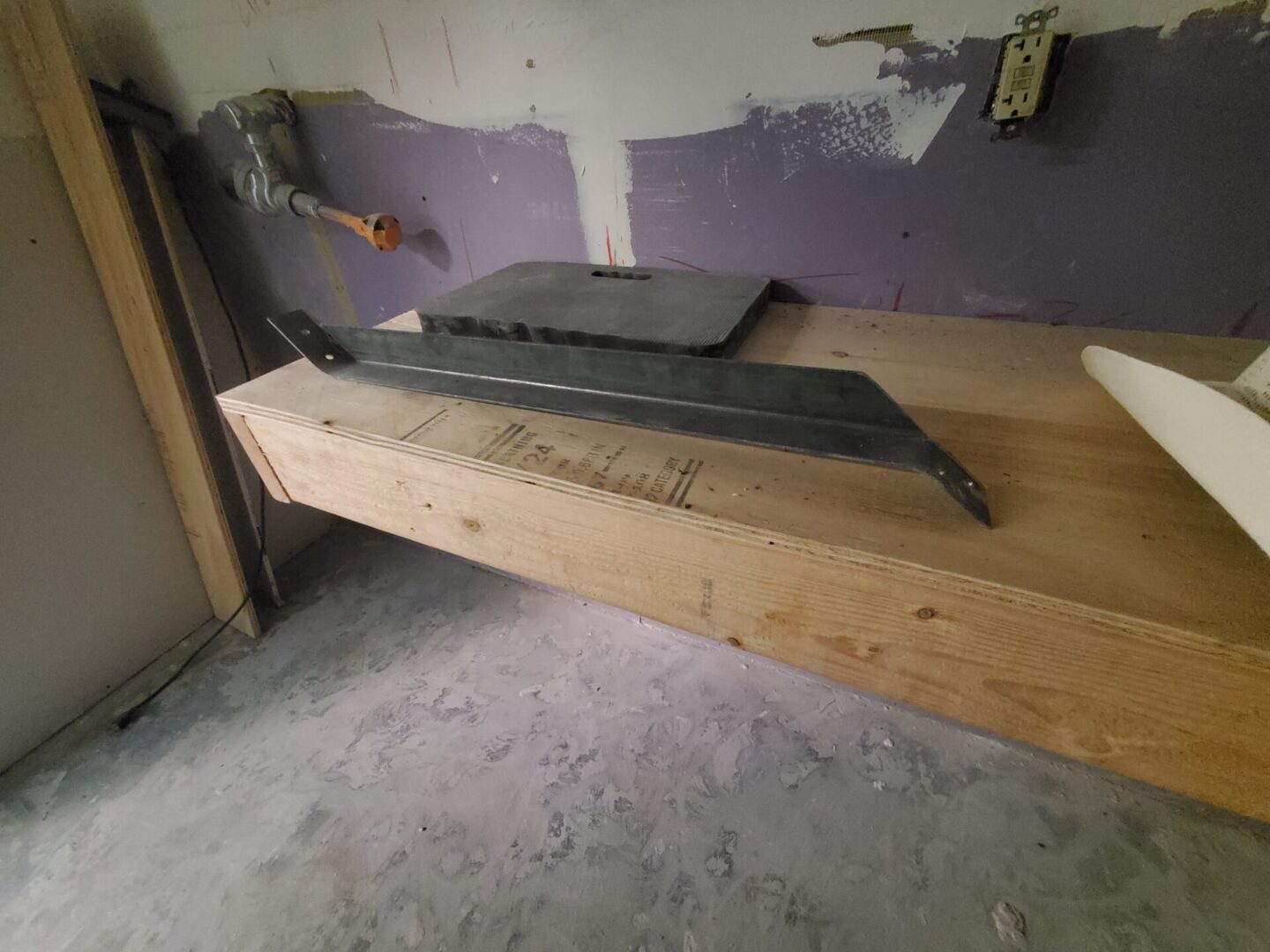 A piece of wood sitting on top of a floor.