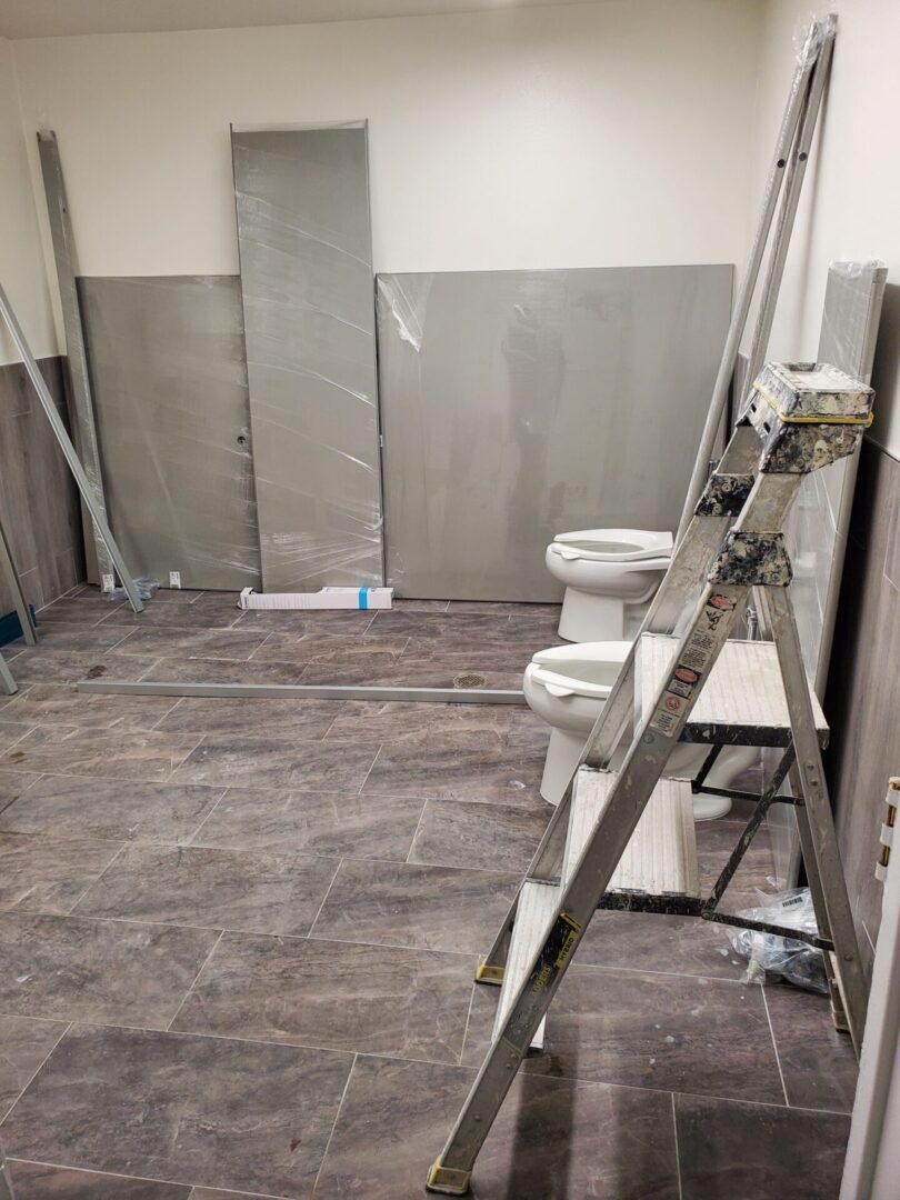 A bathroom being remodeled with the walls removed.