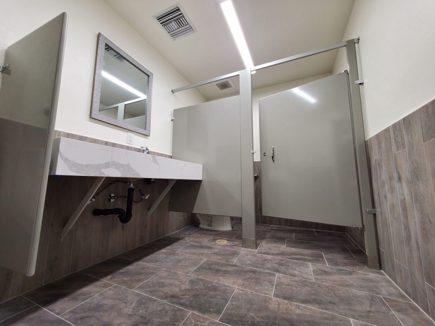 A bathroom with a sink and toilet in it