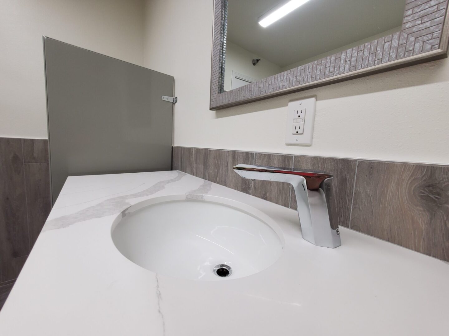 A bathroom sink with a mirror above it.