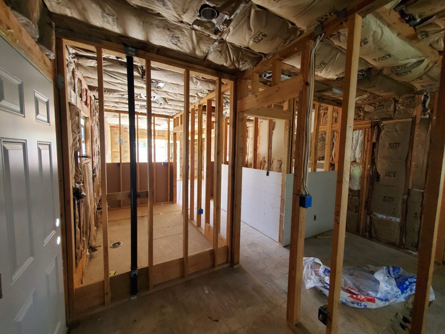 A room with some wood framing and walls