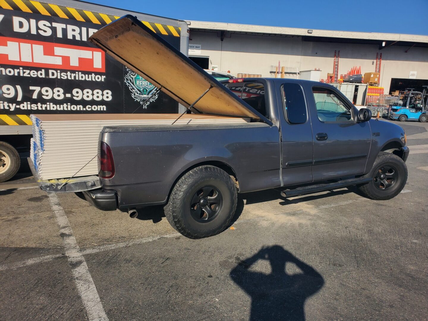 A truck with a large bed in the back of it.