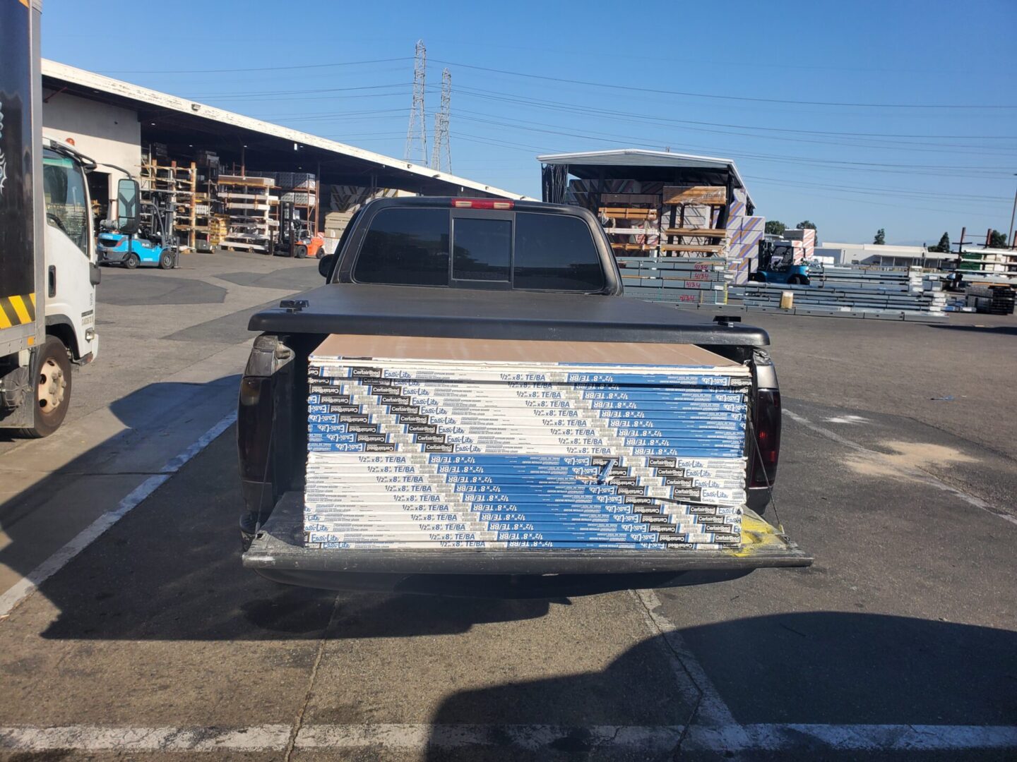 A truck with its back in the parking lot