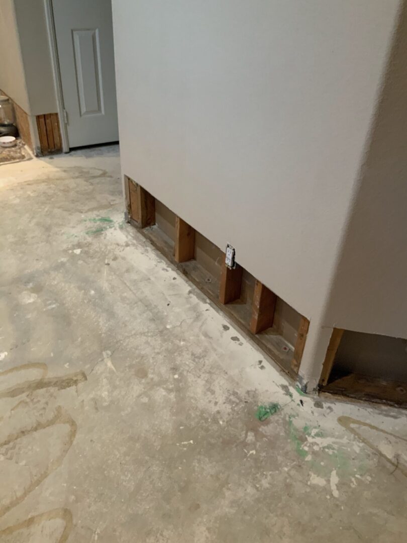 A room with some wood and cement on the floor