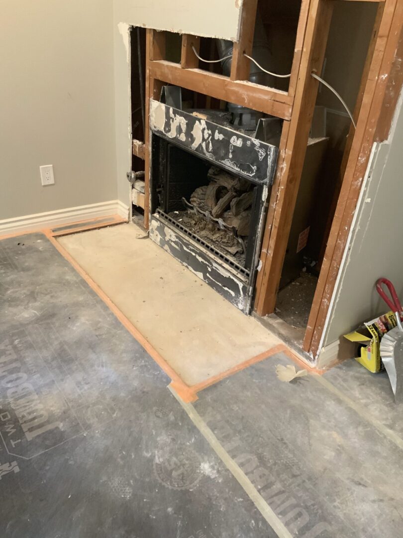 A fireplace being built in the middle of a room.