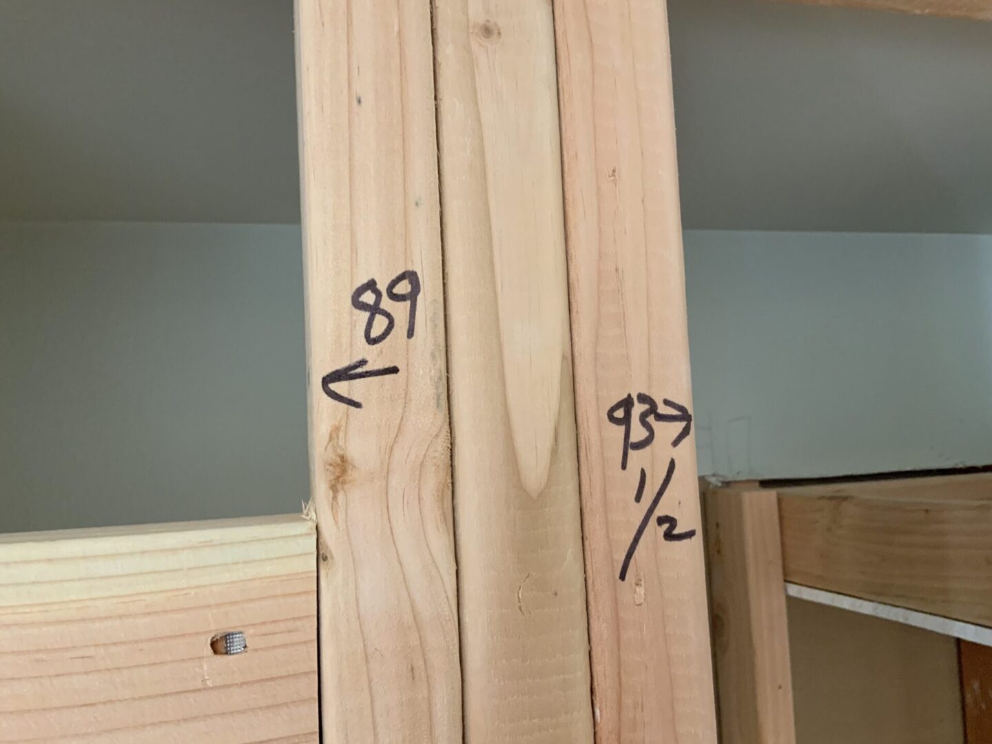 A wooden board with numbers on it