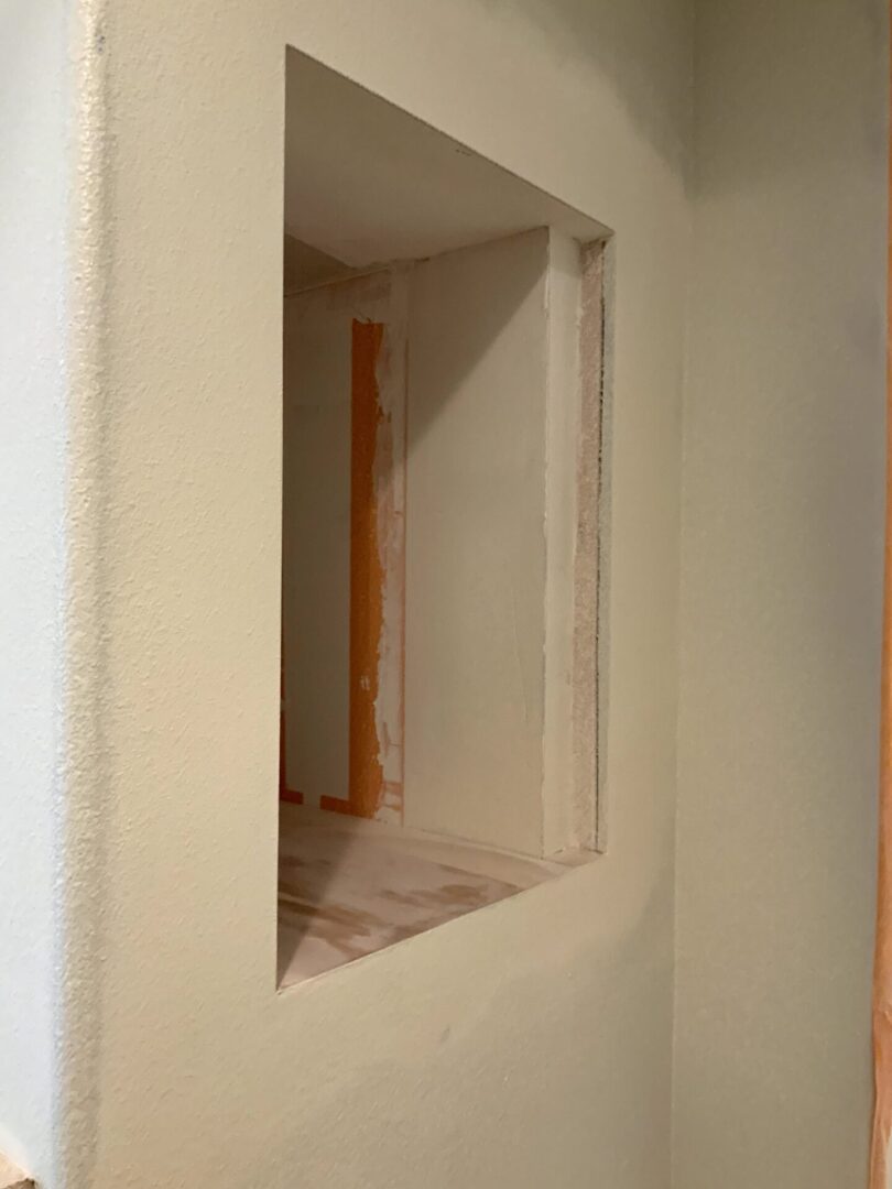 A room with a window and some walls