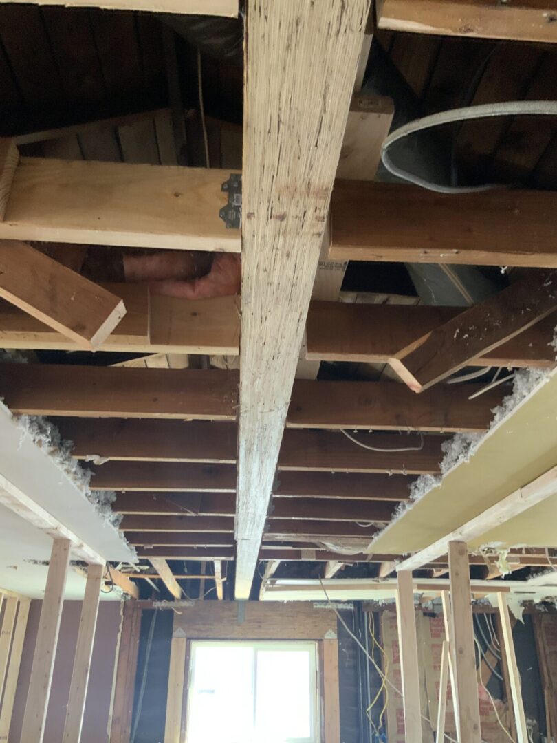 A view of the ceiling in an unfinished room.