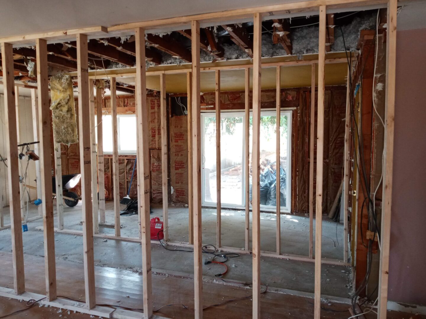 A room being built with wood and metal bars.