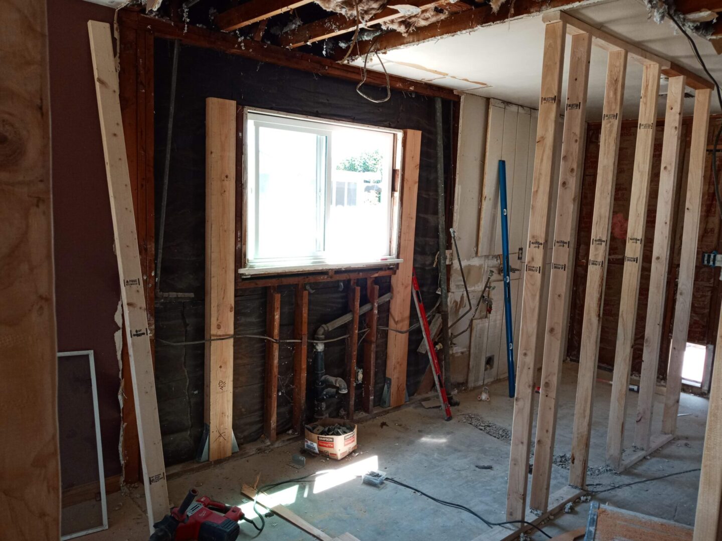 A room being remodeled with wood and other construction materials.