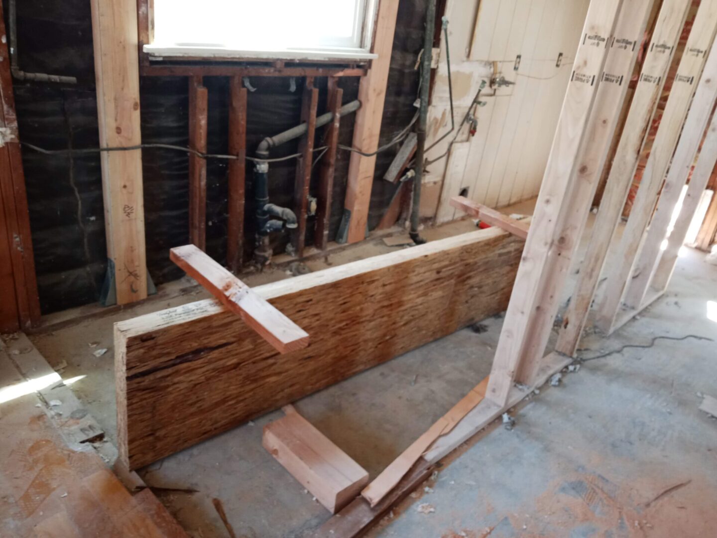 A wooden beam sitting in the middle of a room.