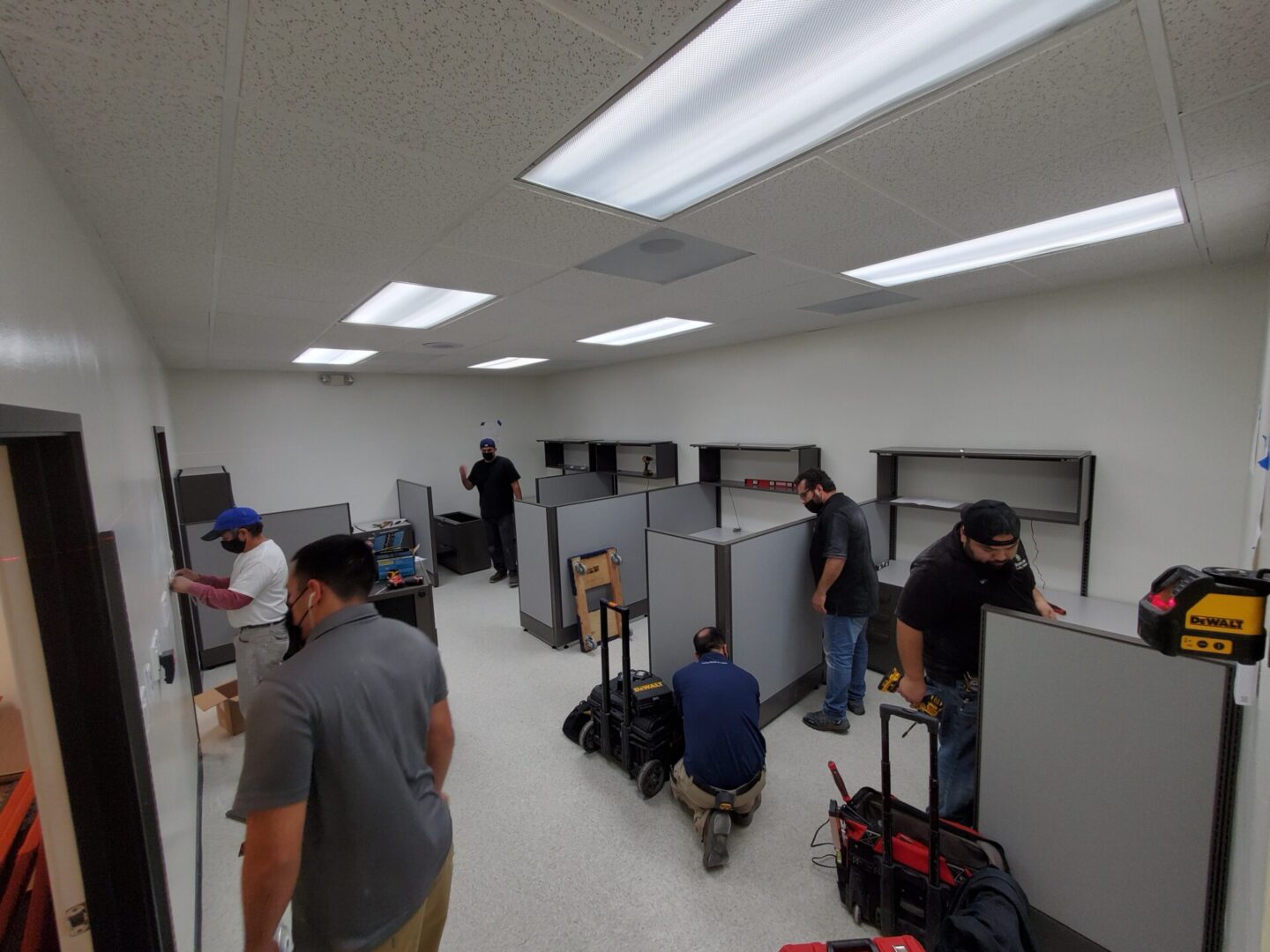 A group of people in an office setting.