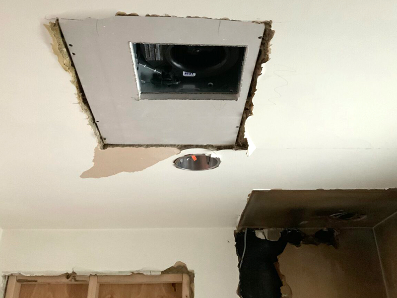 A hole in the ceiling of a room with a hole cut out.