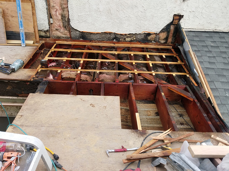 A room being remodeled with wood and metal.