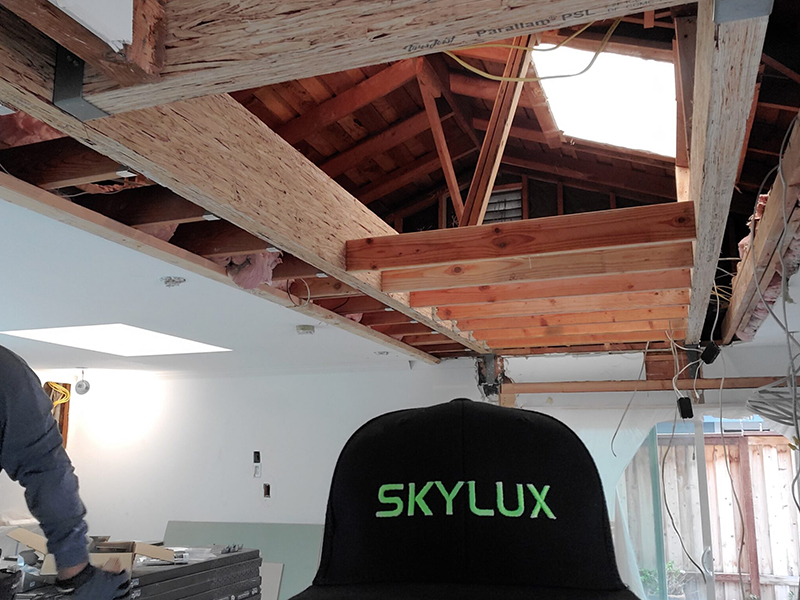 A black hat with the word skylux on it.