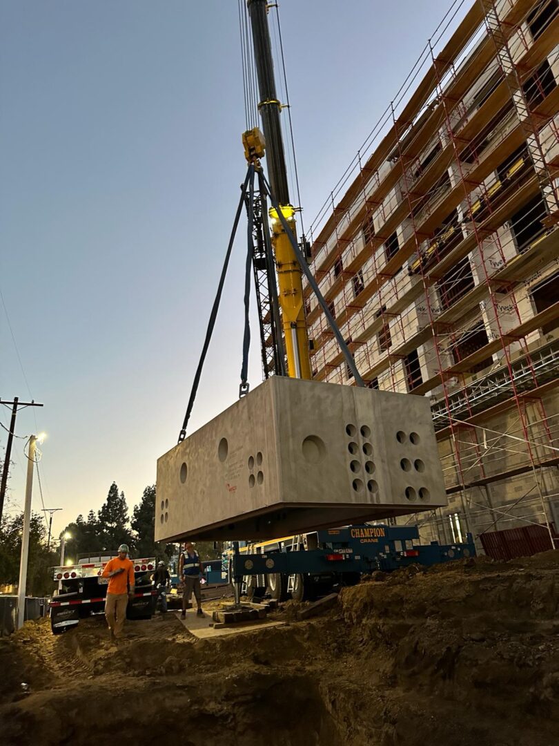 A crane is lifting a large box.