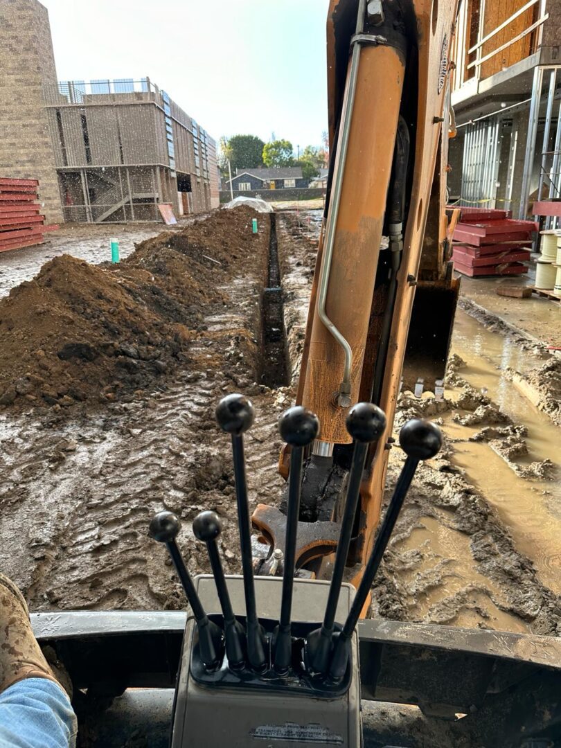 A construction site with a shovel and some dirt