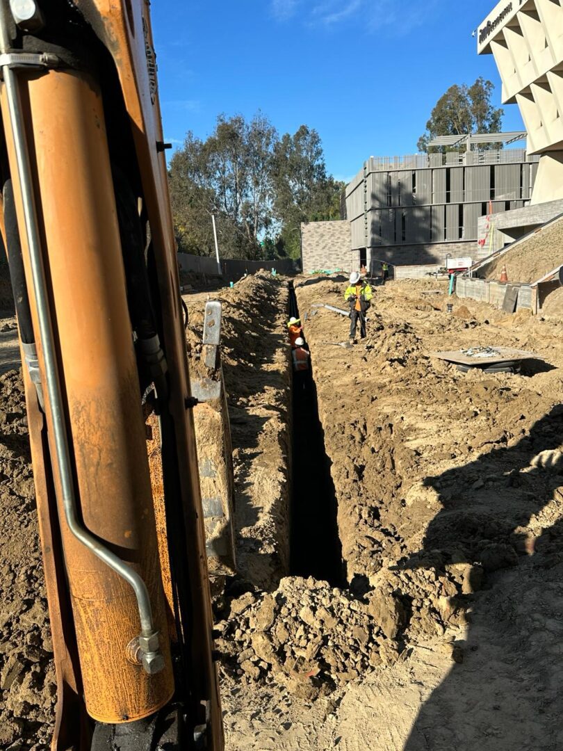 A construction worker is digging in the dirt.