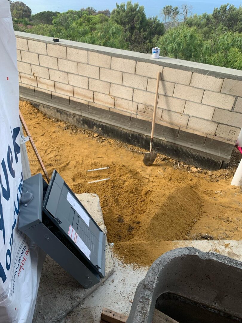 A man digging in the ground with a shovel.